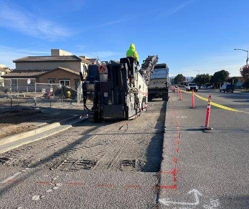 Milling parking lot before asphalt overlay in Columbia, SC.