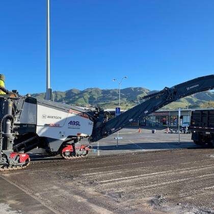 Paving contractors Milling asphalt parking lot in Columbia, SC.