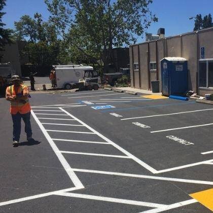 Paving Company in Richland County line striping a new parking lot.