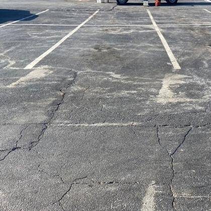 Asphalt paving repairs being assessed by paving contractor in Columbia, SC.